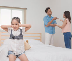 young girl with arguing parents