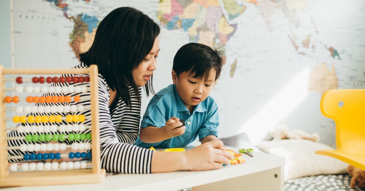 mother and special needs child playing with toys