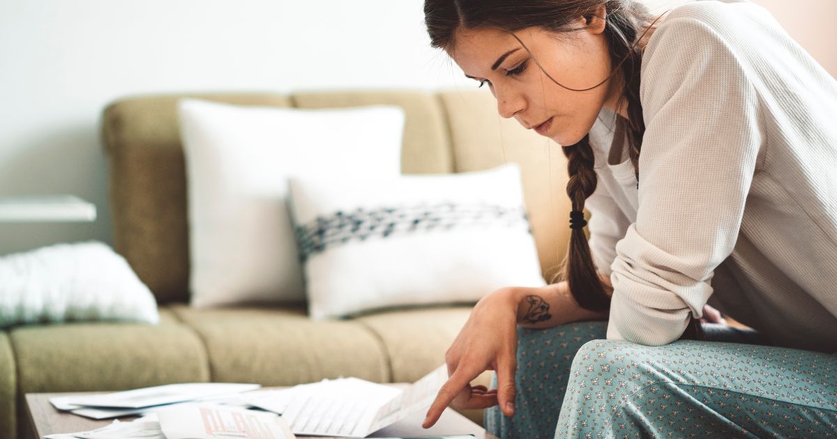 single mother paying bills in her home