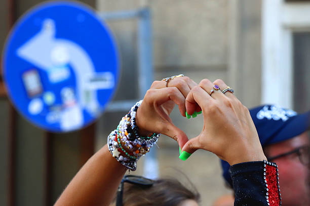 Taylor Swift Fan Making Heart Sign Celebrating Swift Kelce Engagement